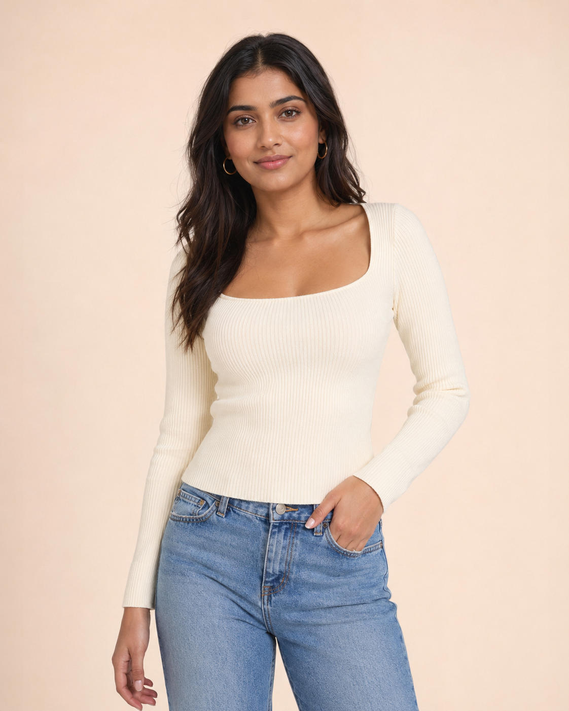 Woman wearing an ivory ribbed square-neck knit top
